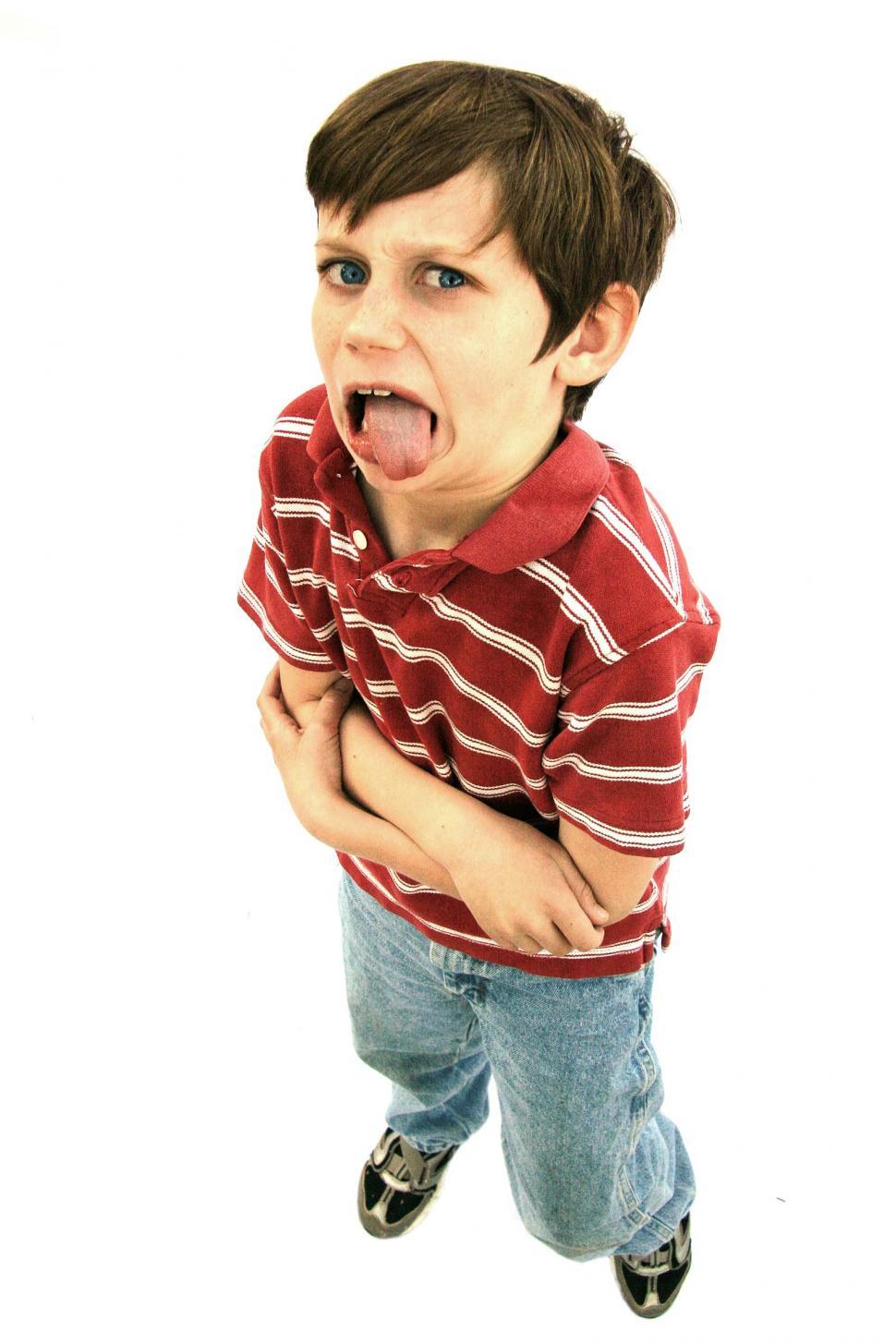Free Image of Boy with goofy disgusted look and arms crossed 
