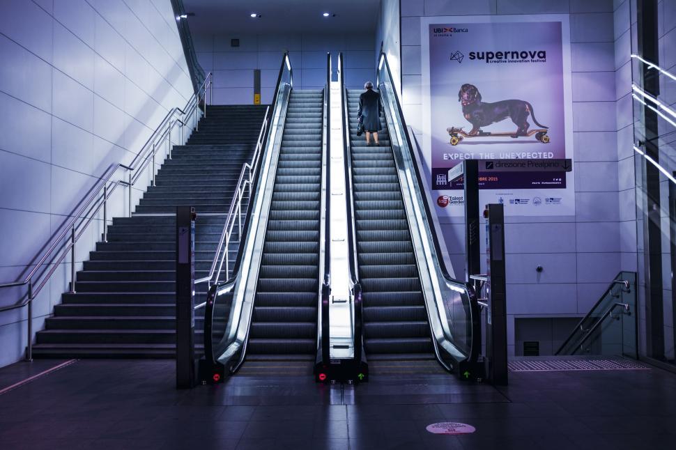 Free Image of Alone Woman on Escalator  