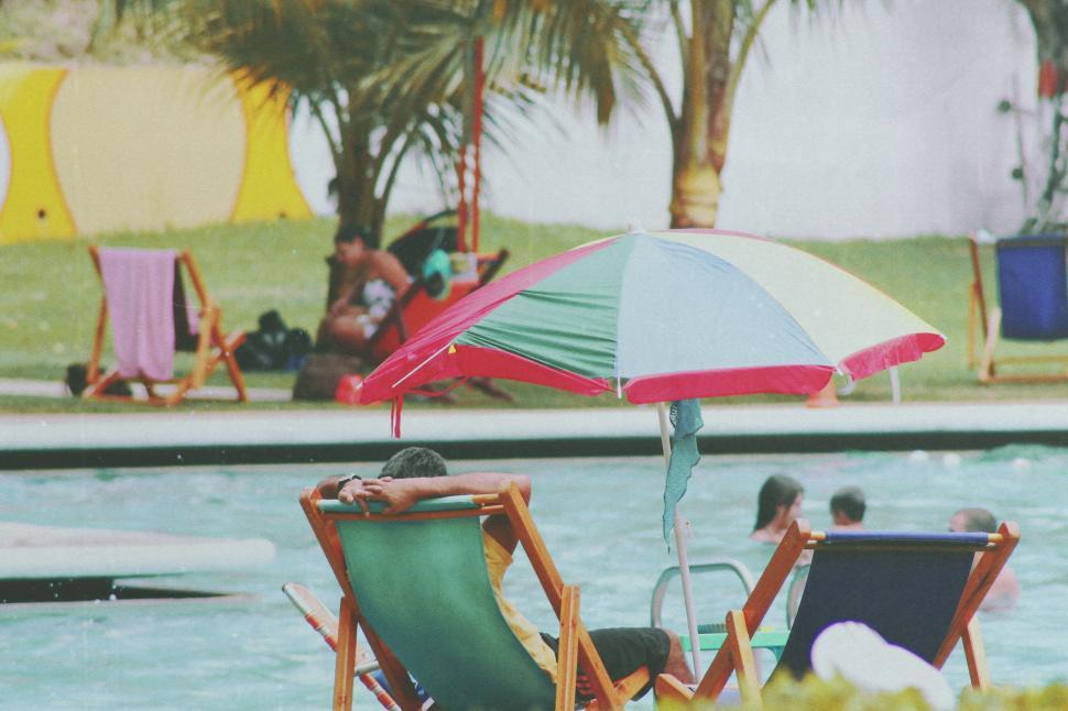 Free Image of People enjoying summer day at the swimming pool  
