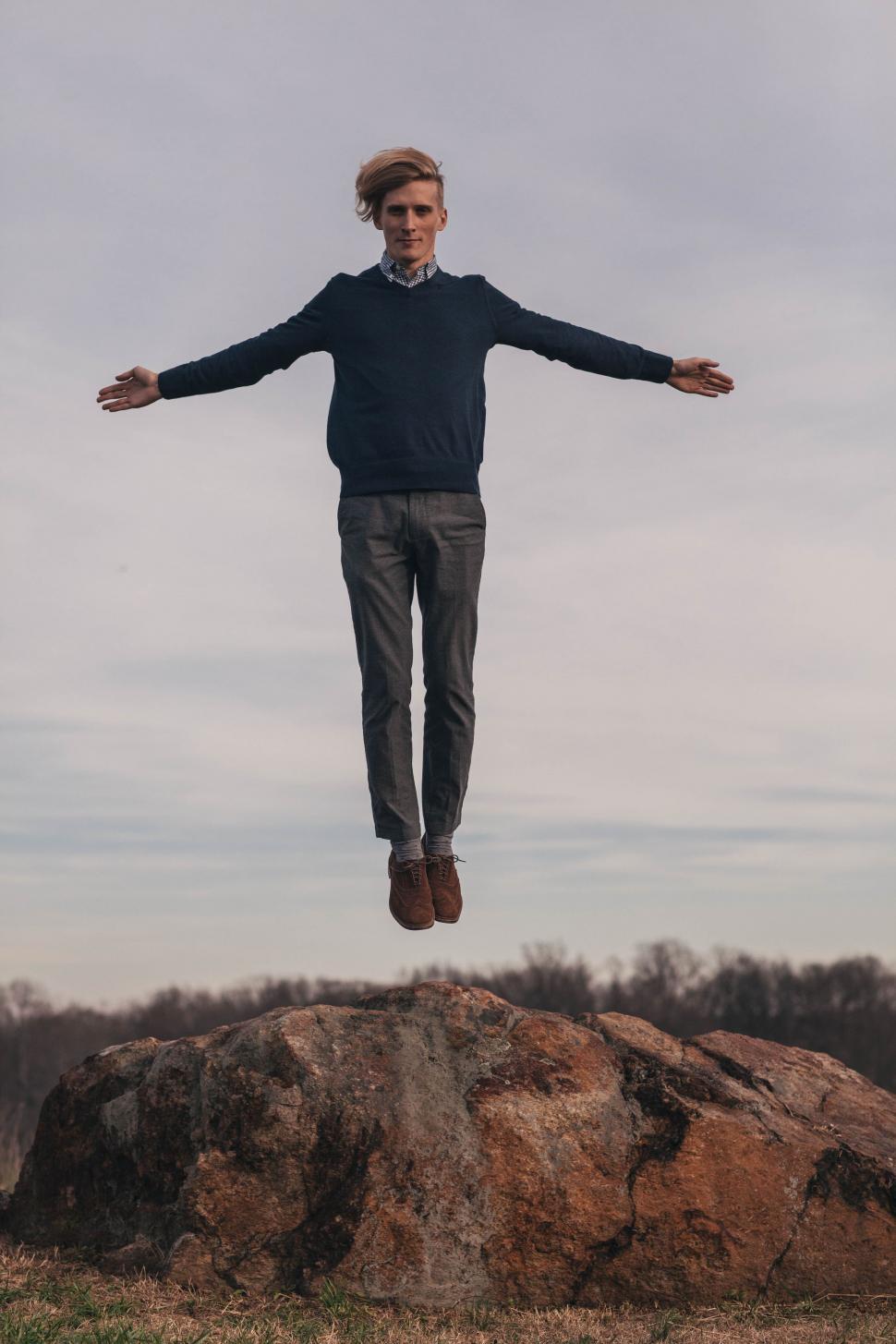 Free Image of Young Man Flying in the air  