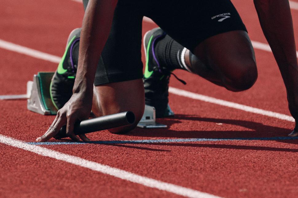 Free Image of Man runner on start position at stadium 