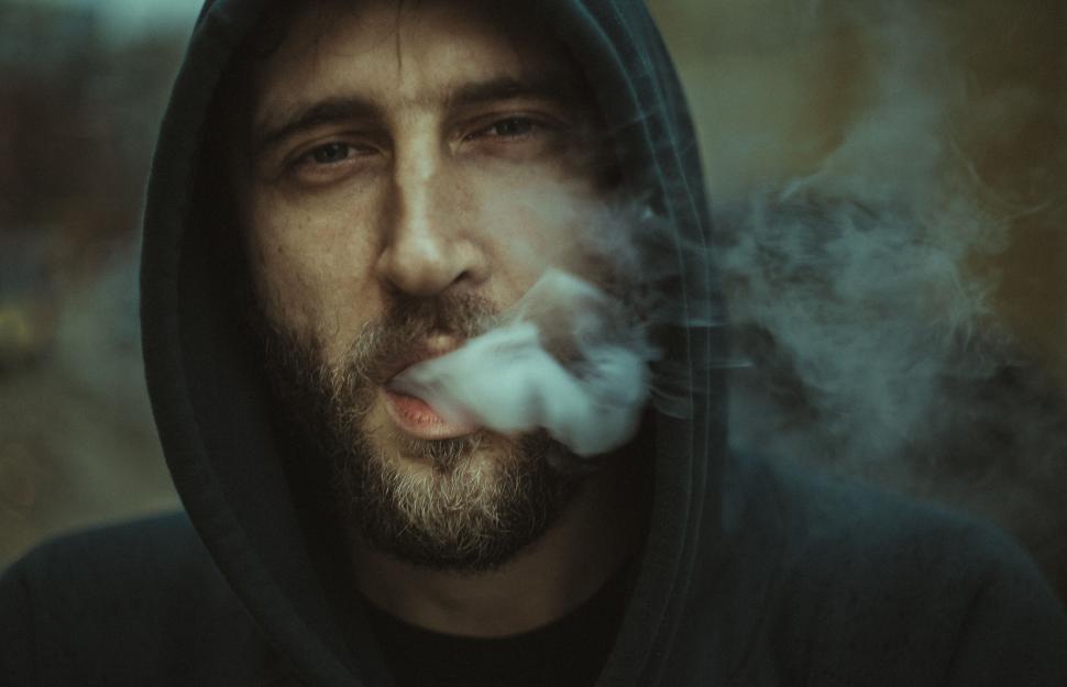 Free Image of Hooded Man Smoking - eye contact  