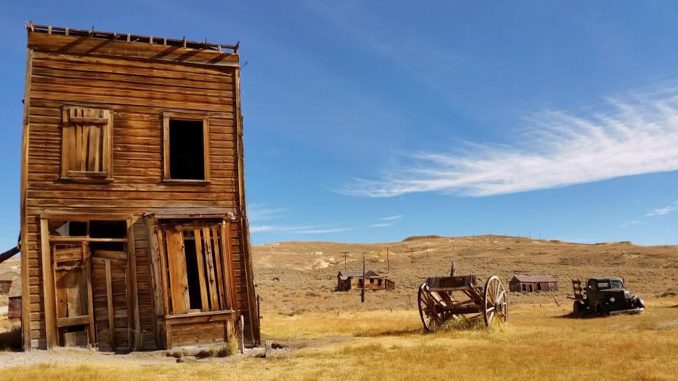 Free Image of Abandoned Wooden House with old car 