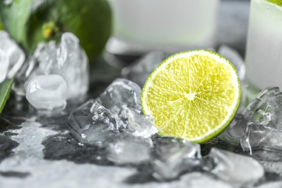 Free Image of Close up a sliced lime on ice 