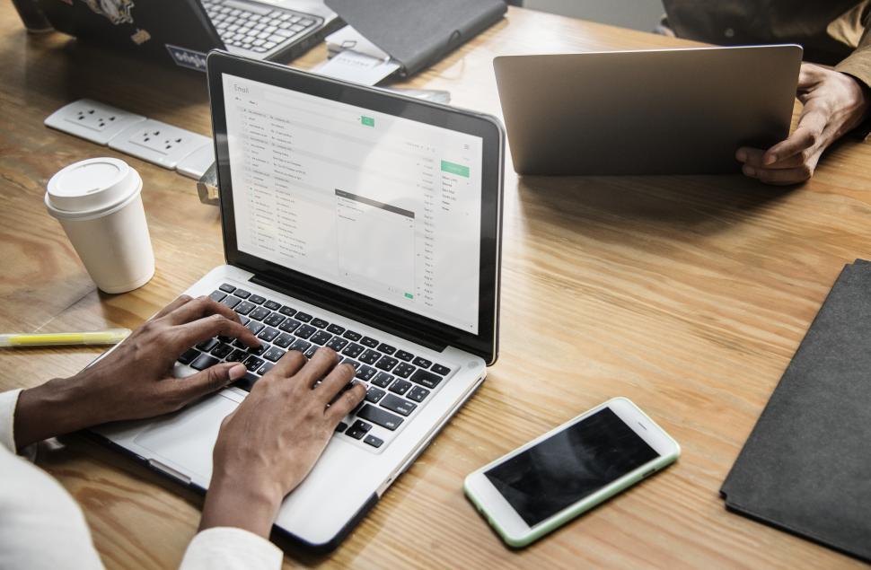Free Image of Woman at workspace typing on the laptop 