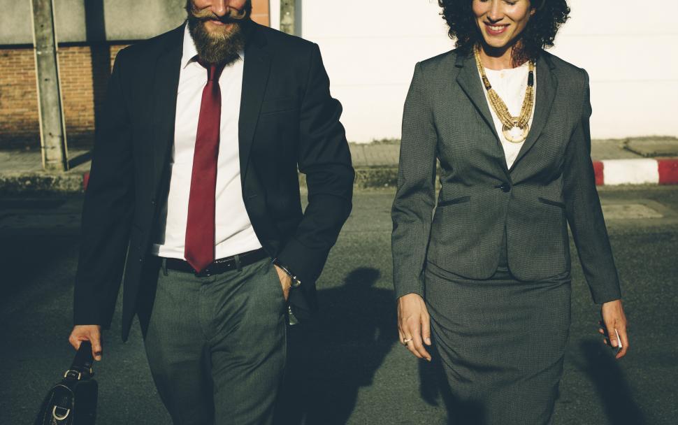 Free Image of Two business people taking a walk outside 