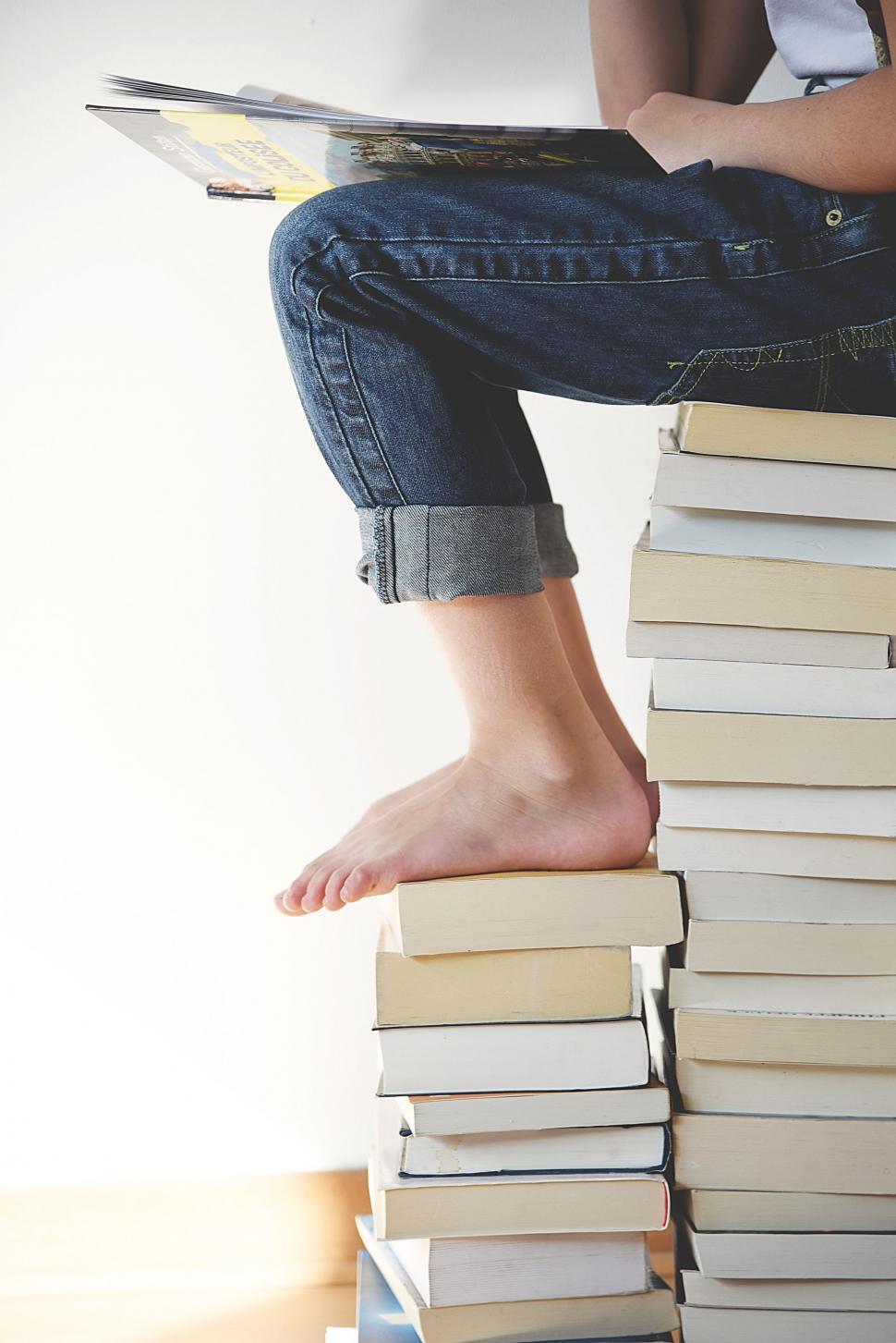 Free Image of Sitting on Books  