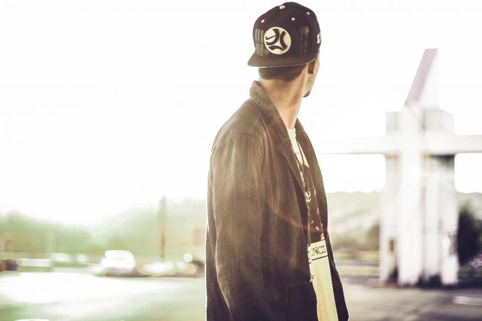 Free Image of Back Side View of Man in reverse cap 