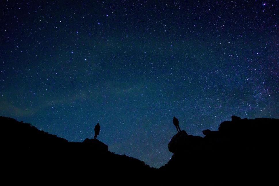 Free Image of People on Cliff with Stars  