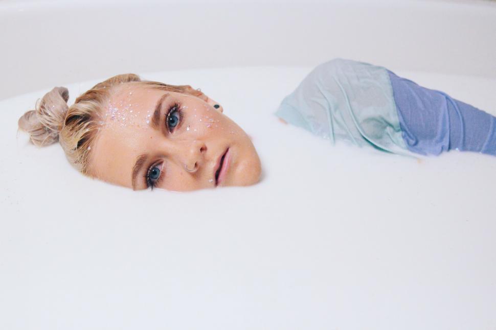 Free Image of Woman in foam bubbles  