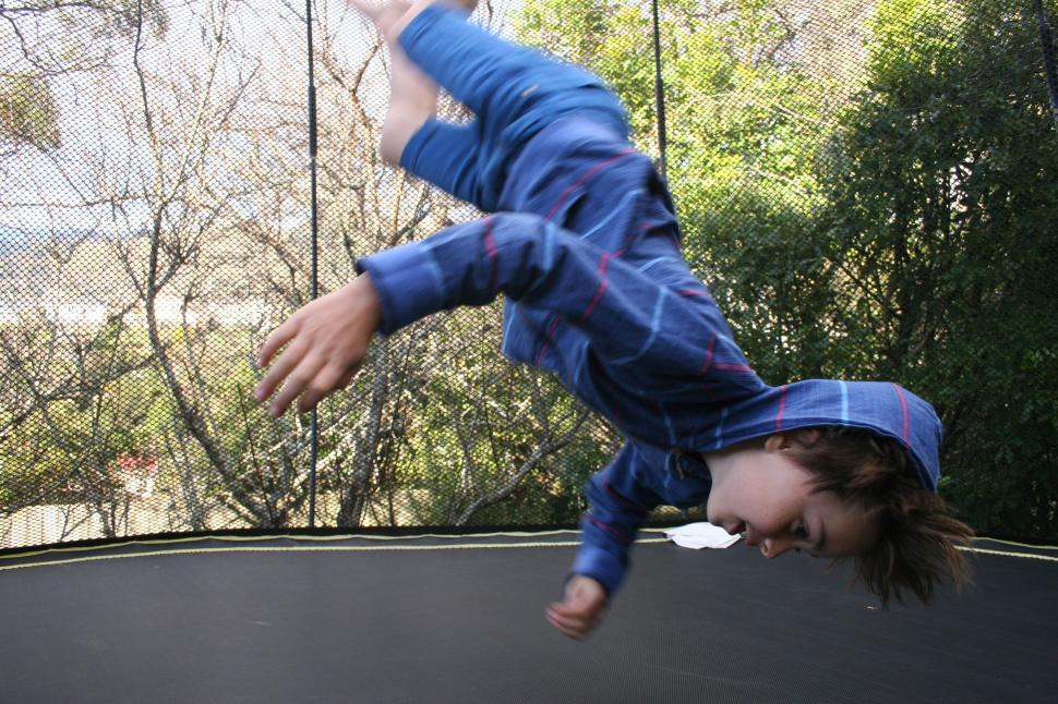 Free Image of Kid on Trampoline 