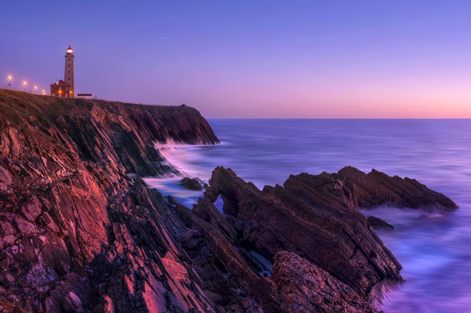 Free Image of Time-lapse photography - Lighthouse and Ocean during sunset  