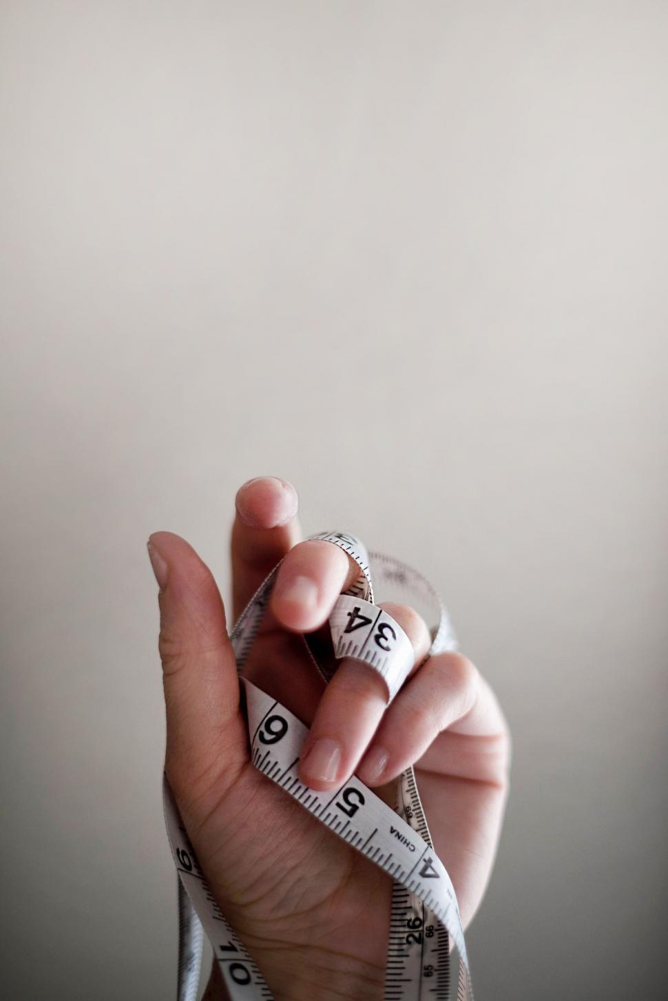 Free Image of Tape measure and Hand  