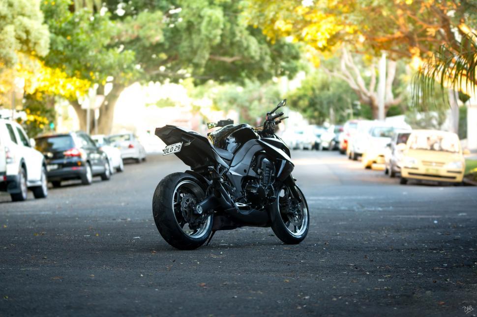 Free Image of Black Motorbike and Cars  