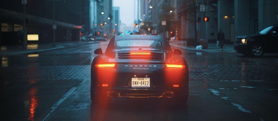 Free Image of Red Backlight of Porsche car 