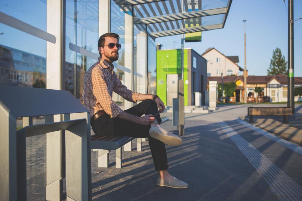 Free Image of Young Man under waiting shed  