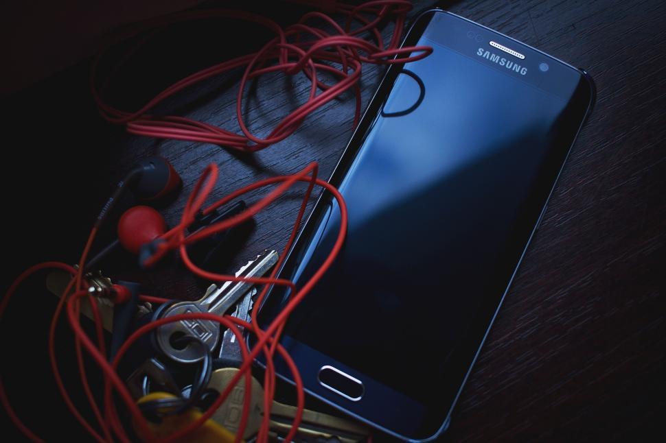 Free Image of Samsung Phone and Handsfree 