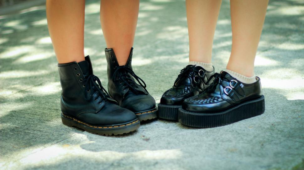 Free Image of Pair of Feet in Black Shoes  
