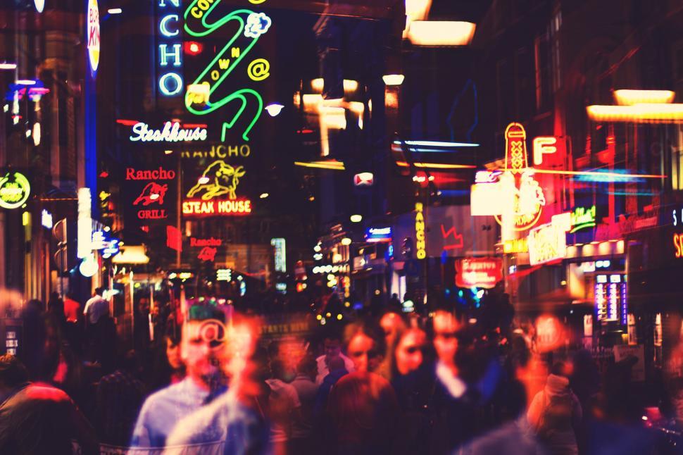 Free Image of Neon signs of shops at night 