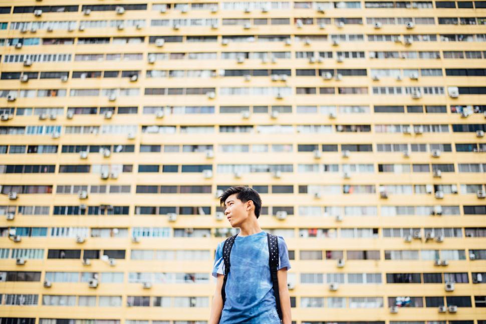 Free Image of Man standing in front of building 