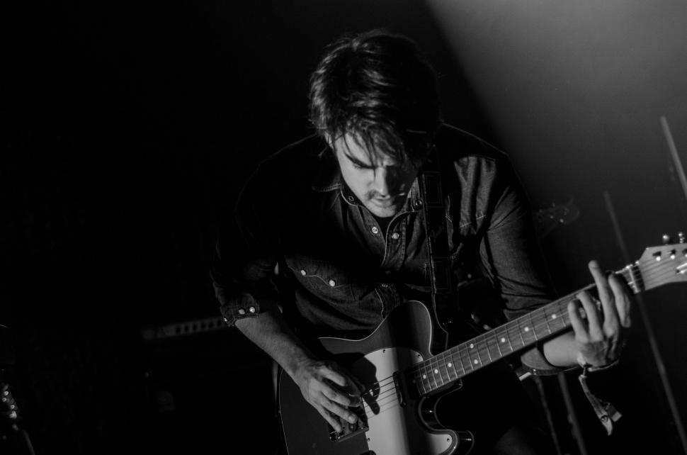 Free Image of Guitarist with Guitar  