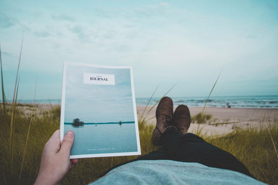 Free Image of Reading Journal at beach  