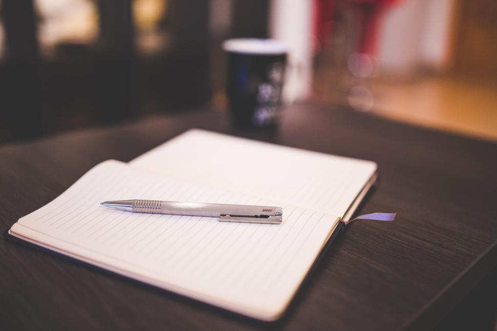 Free Image of Notebook and Pen on table  