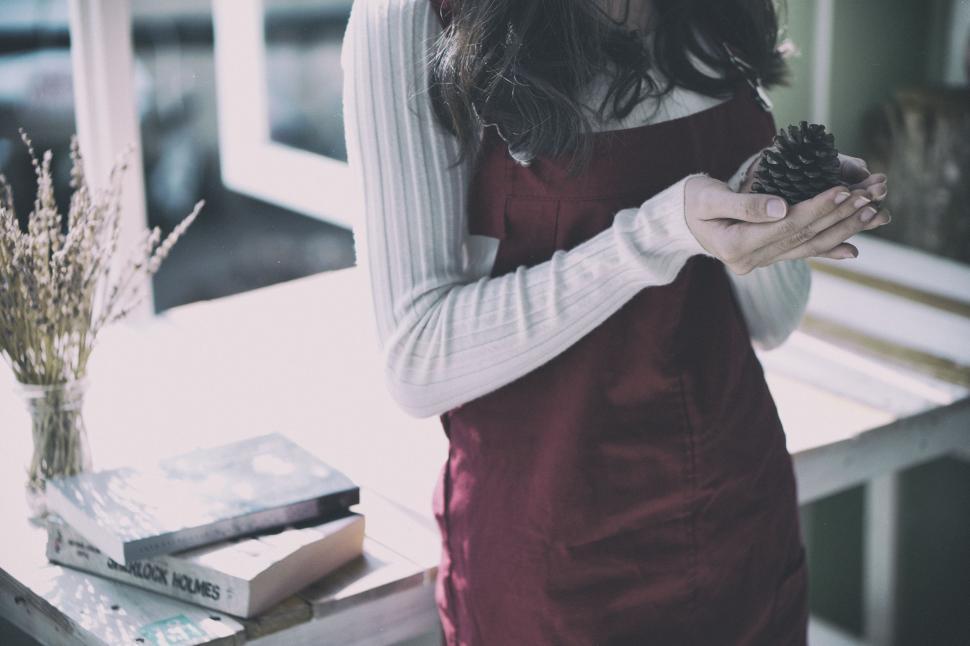 Free Image of Woman with Pine Cone  