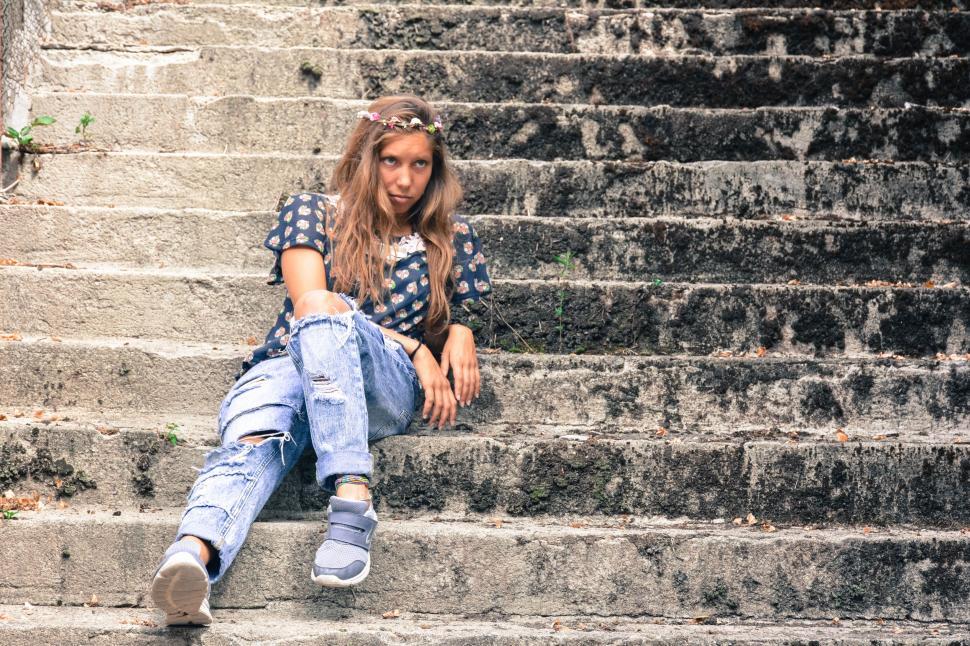 Free Image of Woman with flower wreath on stairs 
