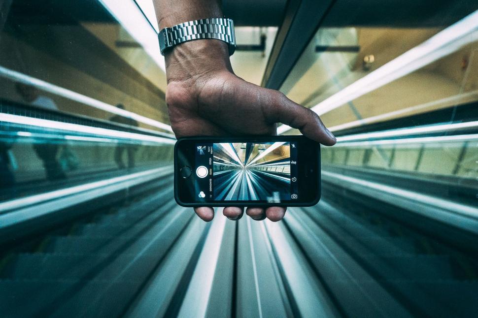 Free Image of Taking picture of escalator with smartphone  