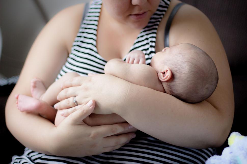Free Image of Mother Holding her newborn baby in arms  