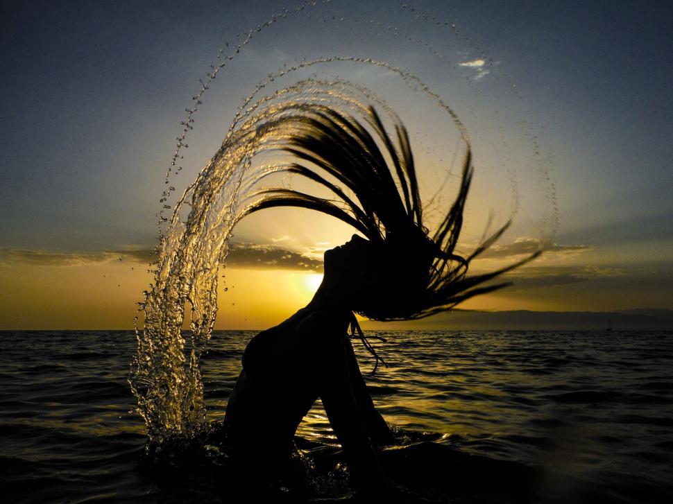Free Image of Woman Hair and Beach With Sunset  