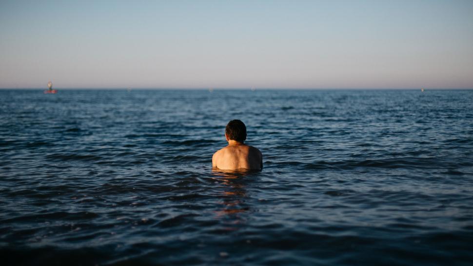 Free Image of Back Side view of man in sea  