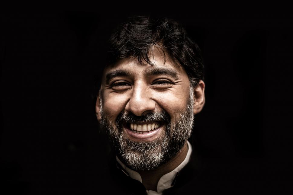 Free Image of Smiling man with white stubble beard 