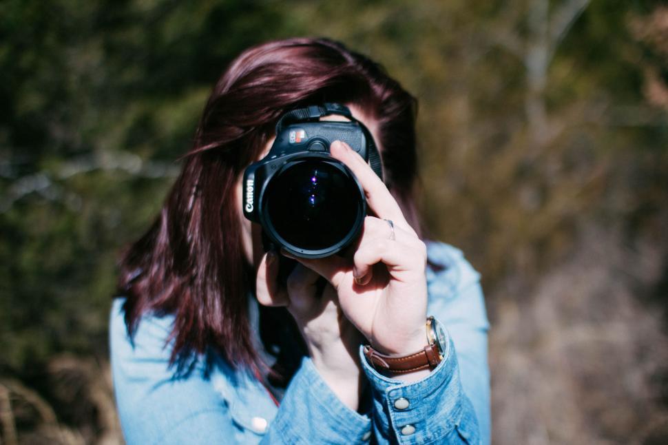 Free Image of Red Hair Woman with Camera  