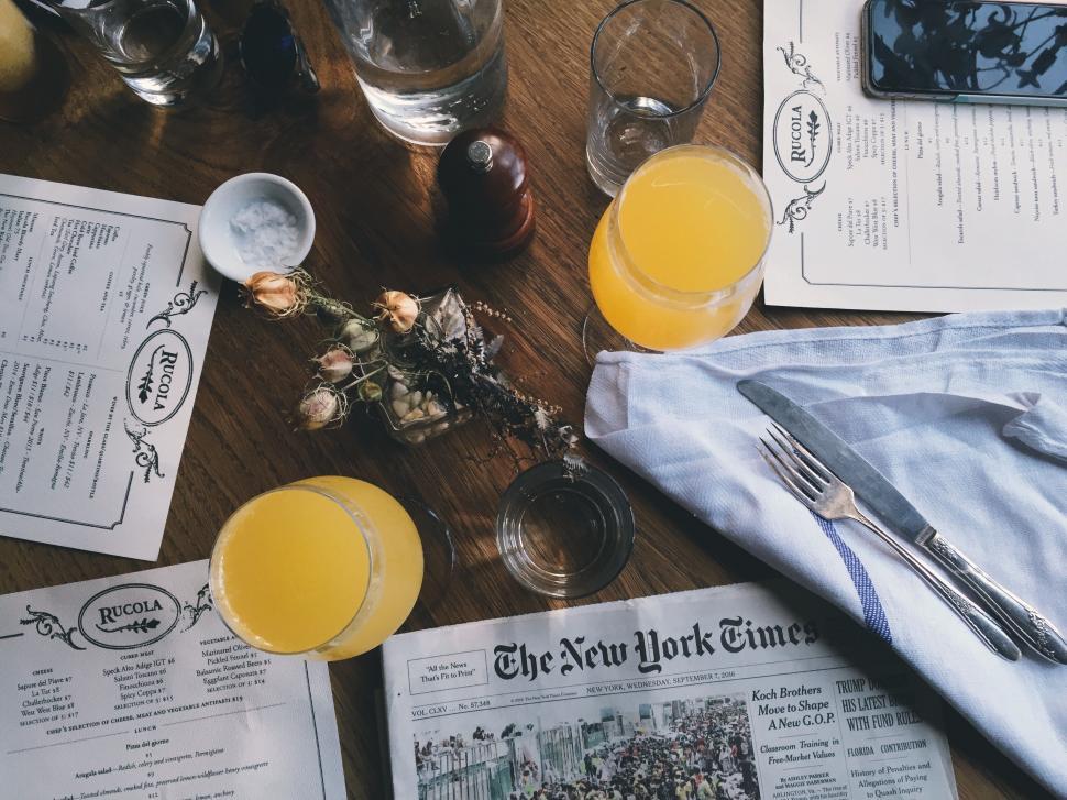 Free Image of Orange Juice Glasses in a Restaurant 