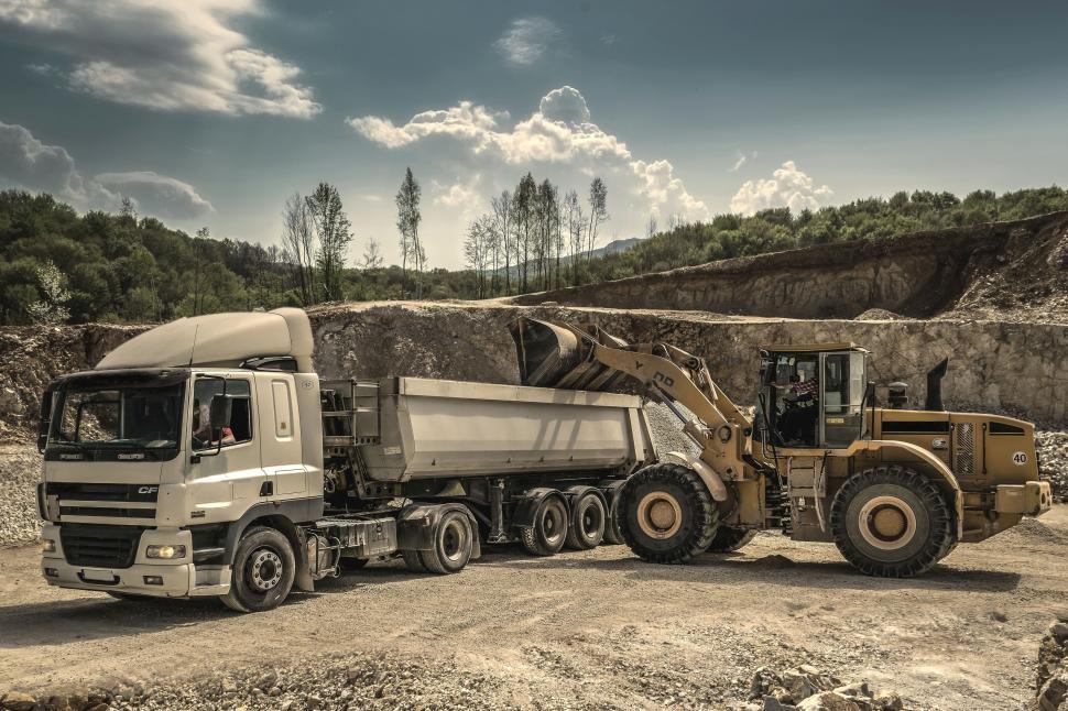 Free Image of Excavator machine and Truck  
