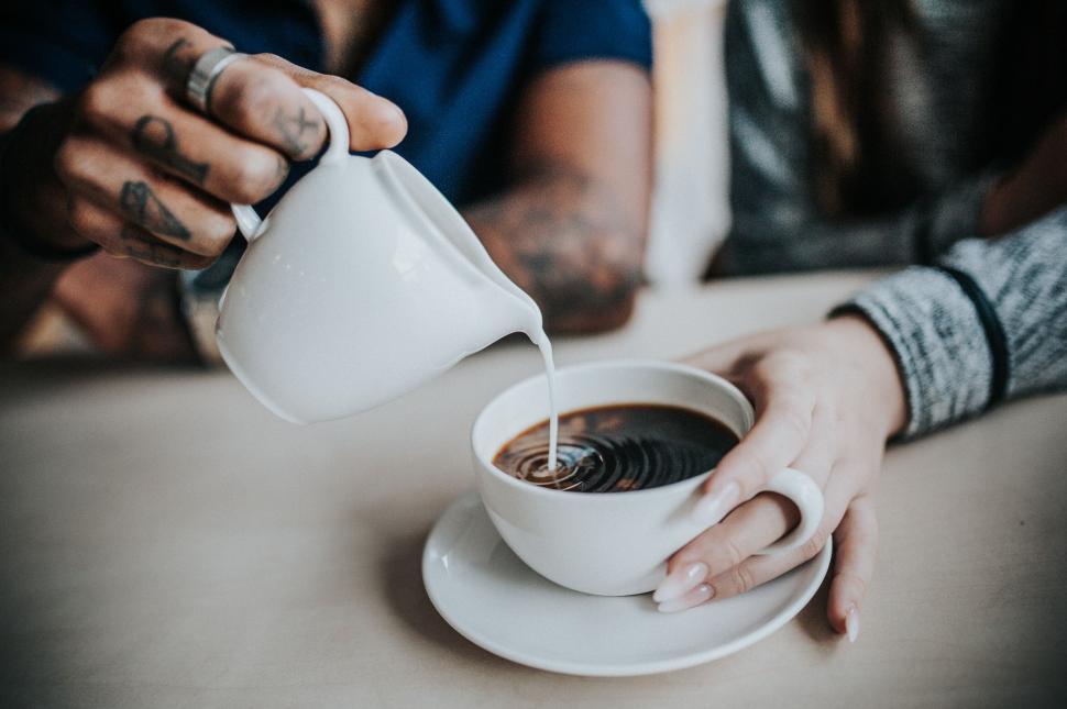 Free Image of Adding Milk into coffee  