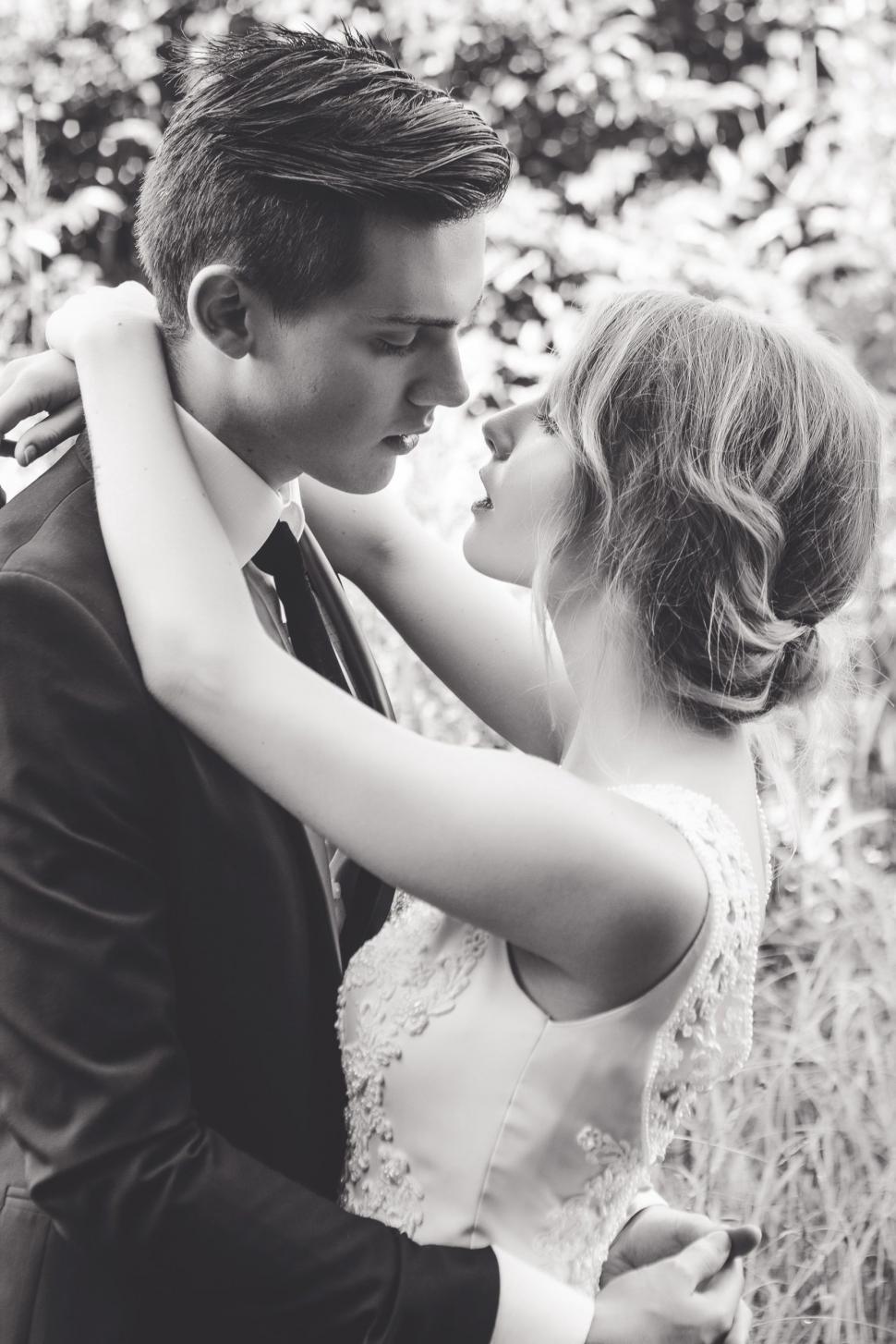 Free Image of Couple standing face to face in arms 