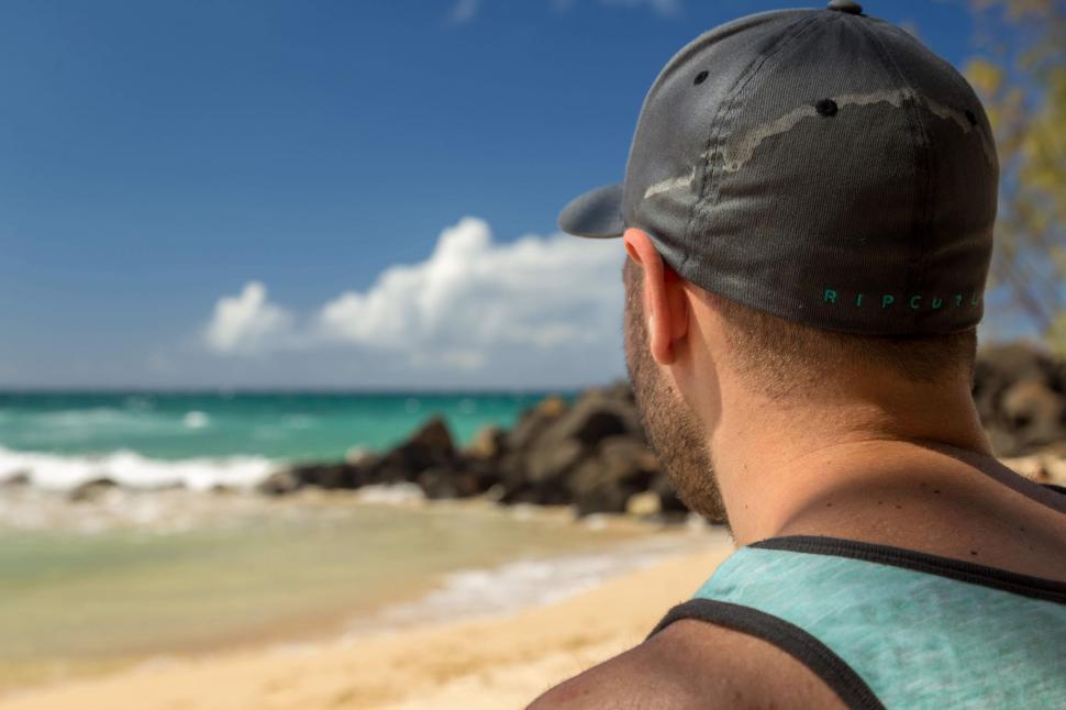Free Image of Man in cap on beach  