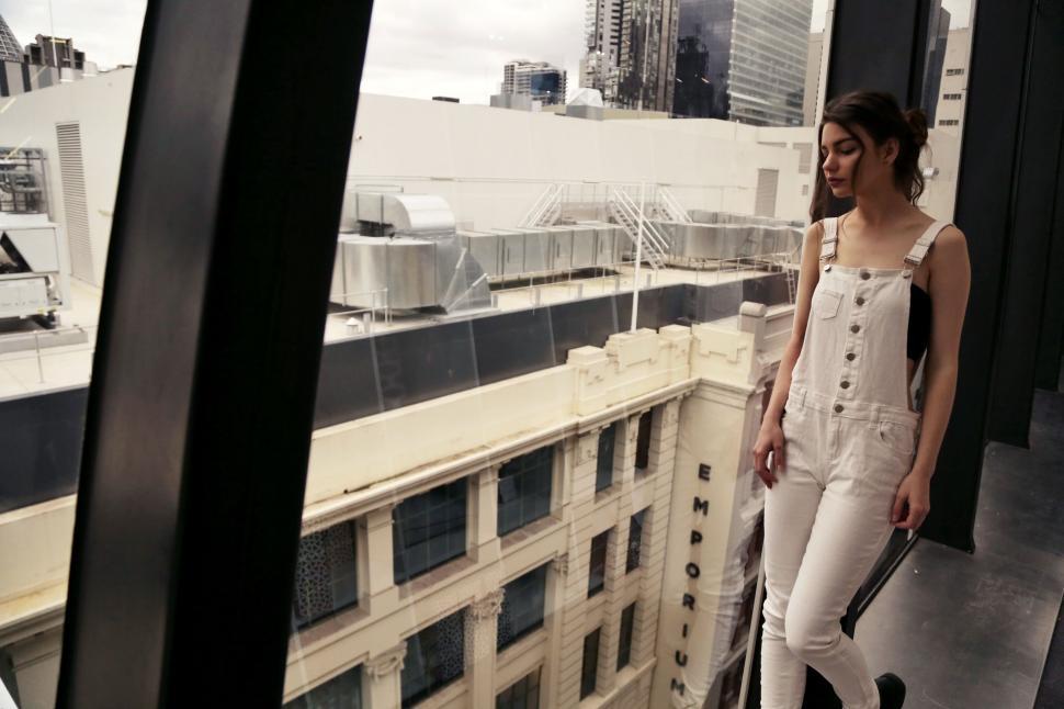 Free Image of Female Fashion Model Posing Near Window  