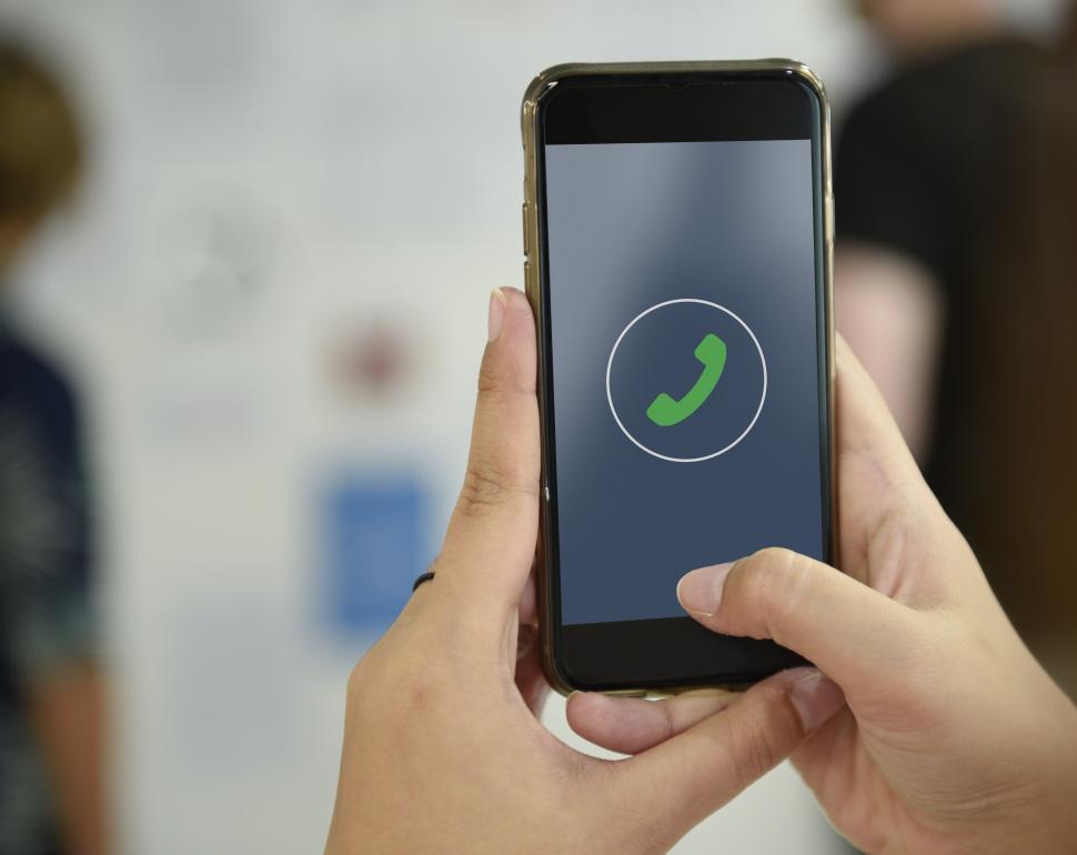 Free Image of Close up of a smart phone in a person s hands, call icon 
