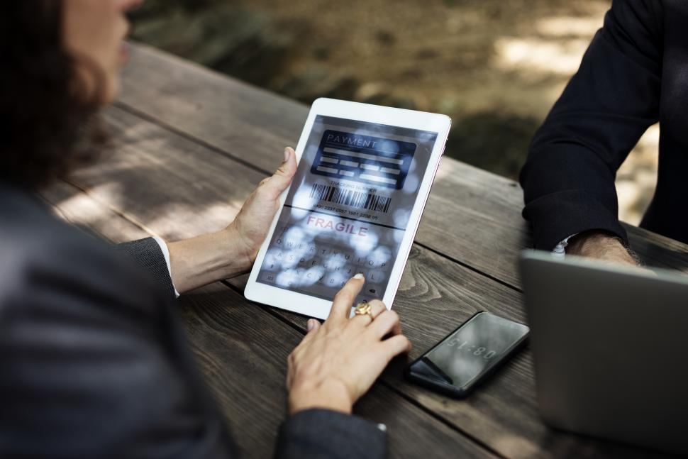Free Image of Close up of a tablet PC in a womans hands - mobile payments 
