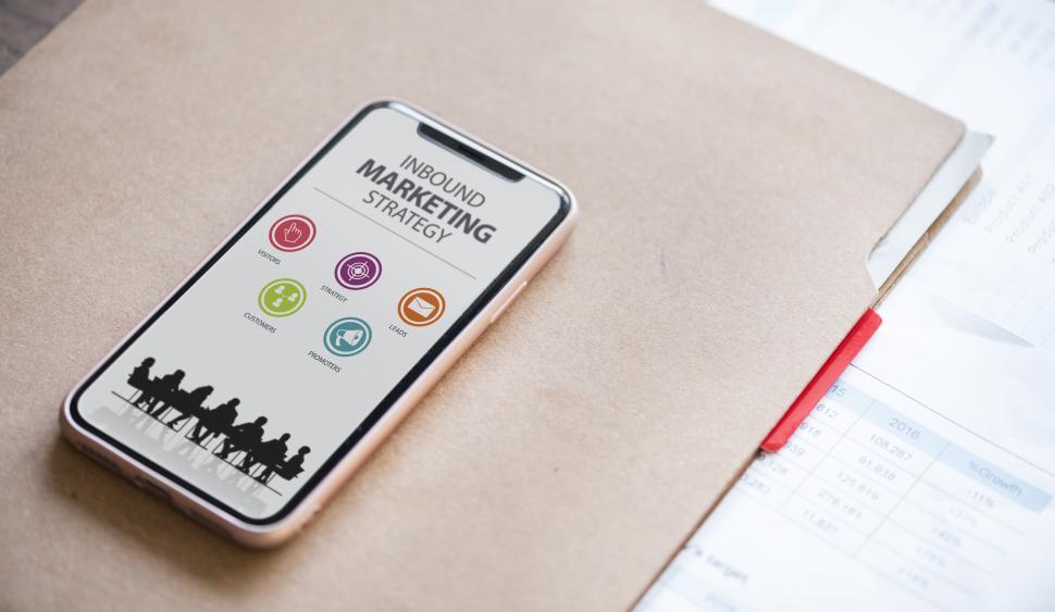 Free Image of Close up of a mobile phone on a file folders 
