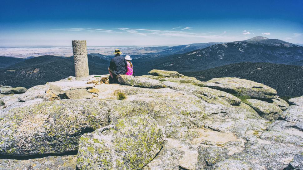 Free Image of Backside view of Couple on mossy rock  
