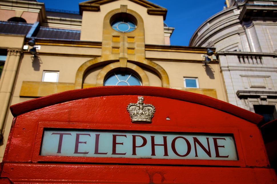 Free Image of Red Telephone Booth in Front of Building 