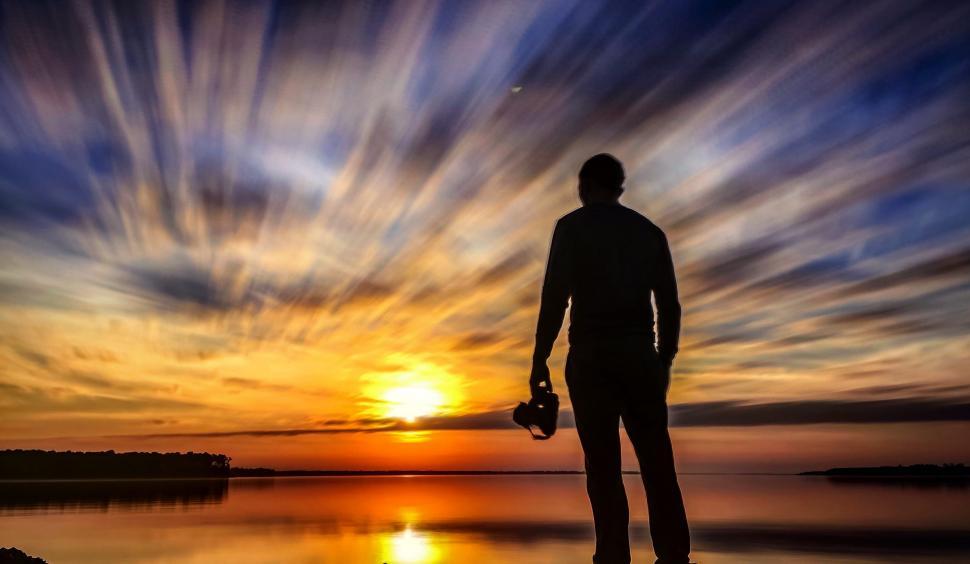 Free Image of Backside View of Photographer with Sunset  
