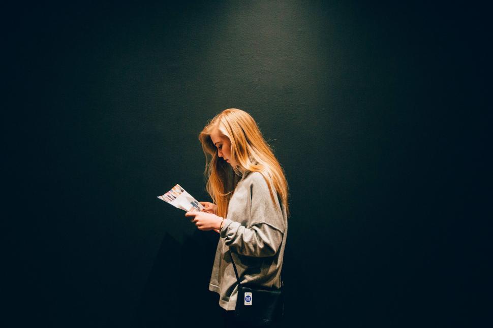 Free Image of Woman with Magazine on black background  