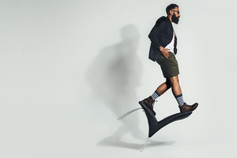 Free Image of Balancing On Chair on White Background  