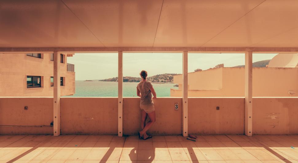 Free Image of Woman Standing at the window 